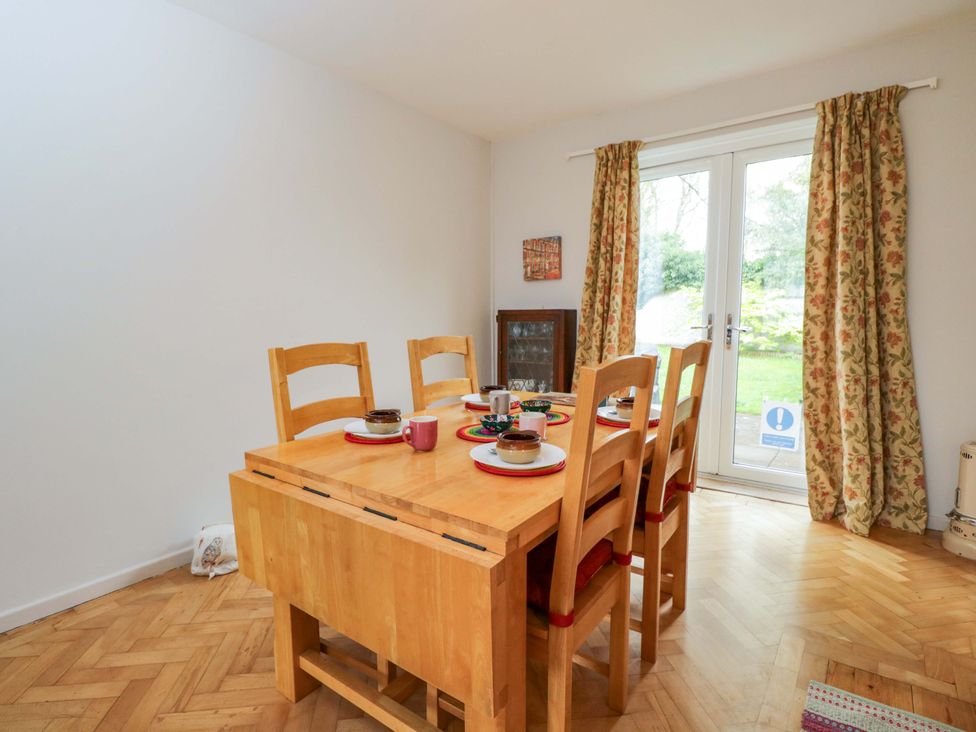A dining room with a table and chairs at Highbury in Bath