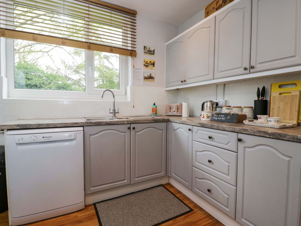 A kitchen with a sink and dishwasher at Highbury in Bath