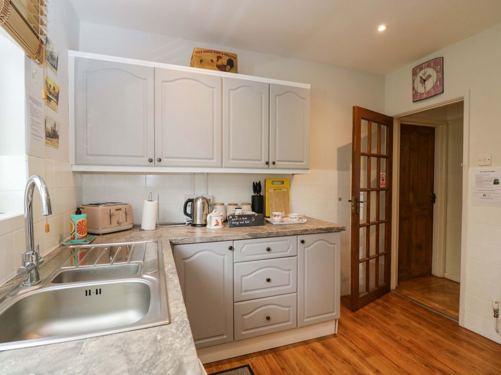 A kitchen with cabinets and appliances at Highbury in Bath