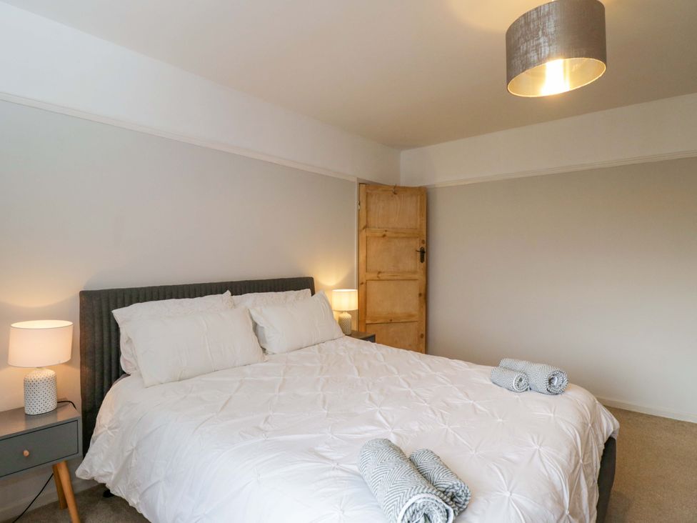 A bedroom with a bed and bedside table at Highbury in Bath