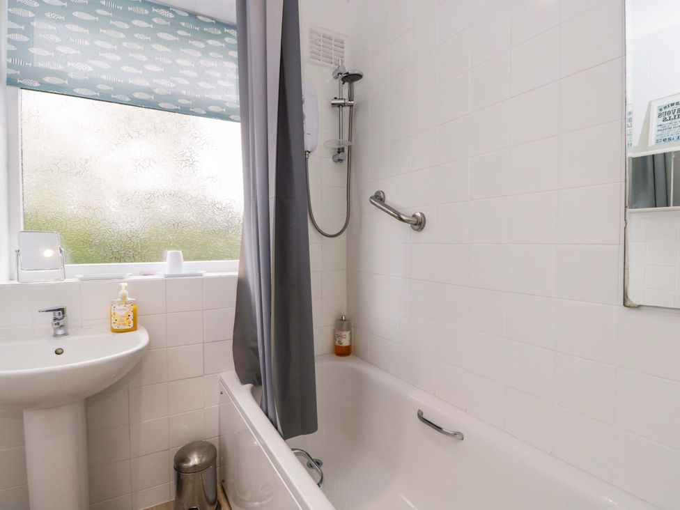 A bathroom with a bathtub and sink at Highbury in Bath
