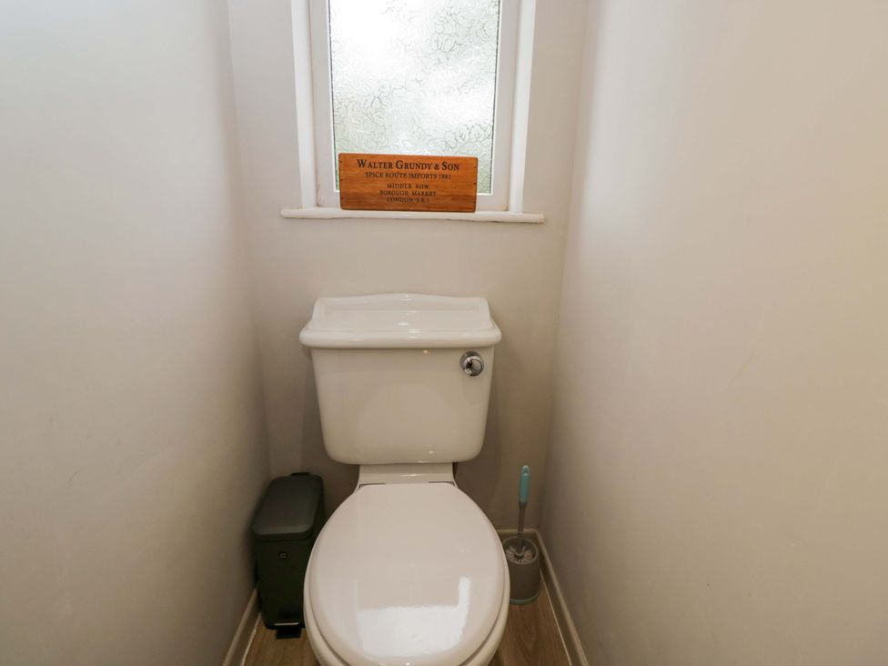 A bathroom with a toilet and window at Highbury in Bath