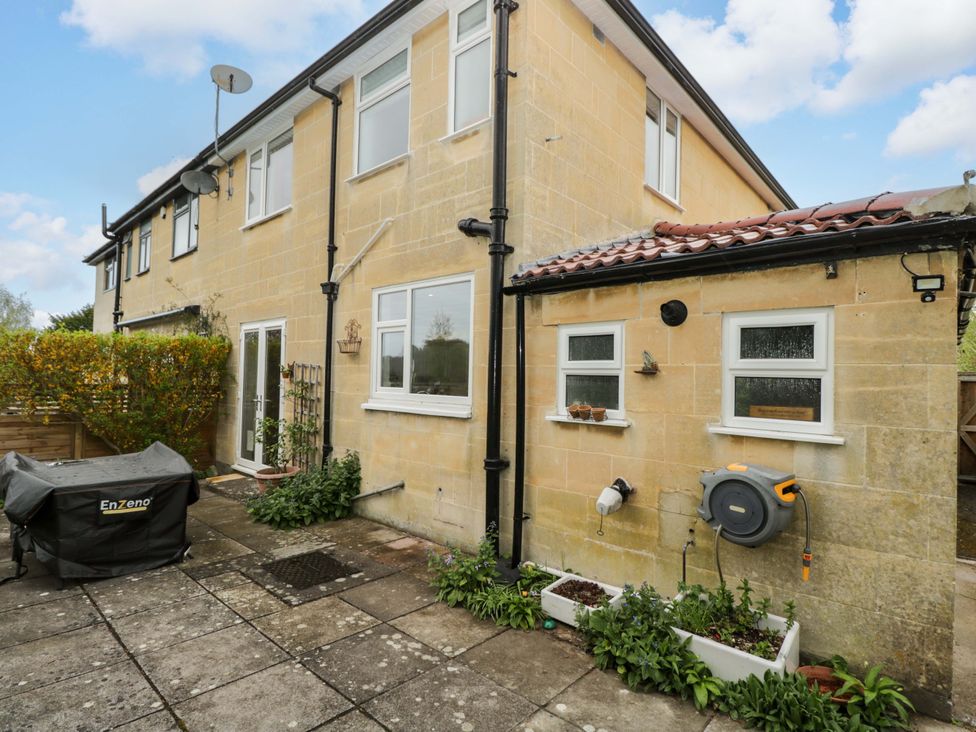 An outdoor area with a storage box and greenery at Highbury in Bath