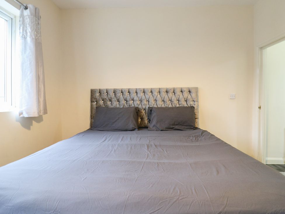 A bedroom with a bed and window at Peckhamsbest Suite in London