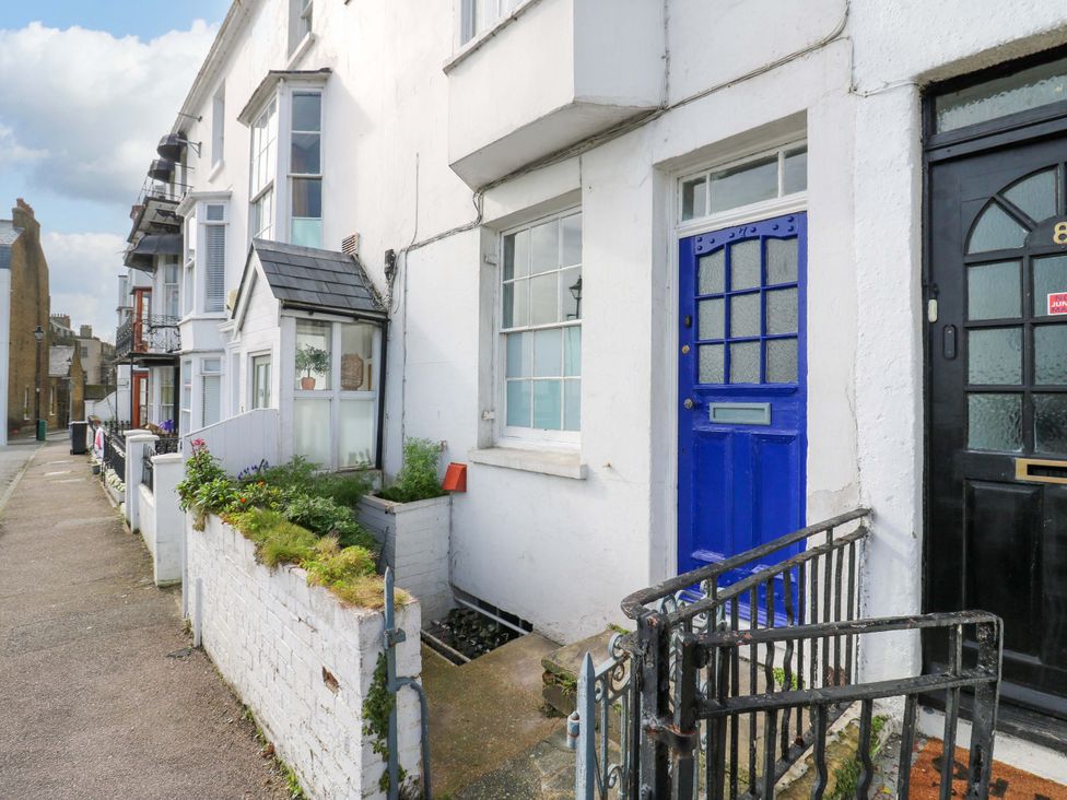 An exterior view of two doors with plants in front at 7 Athol Terrace