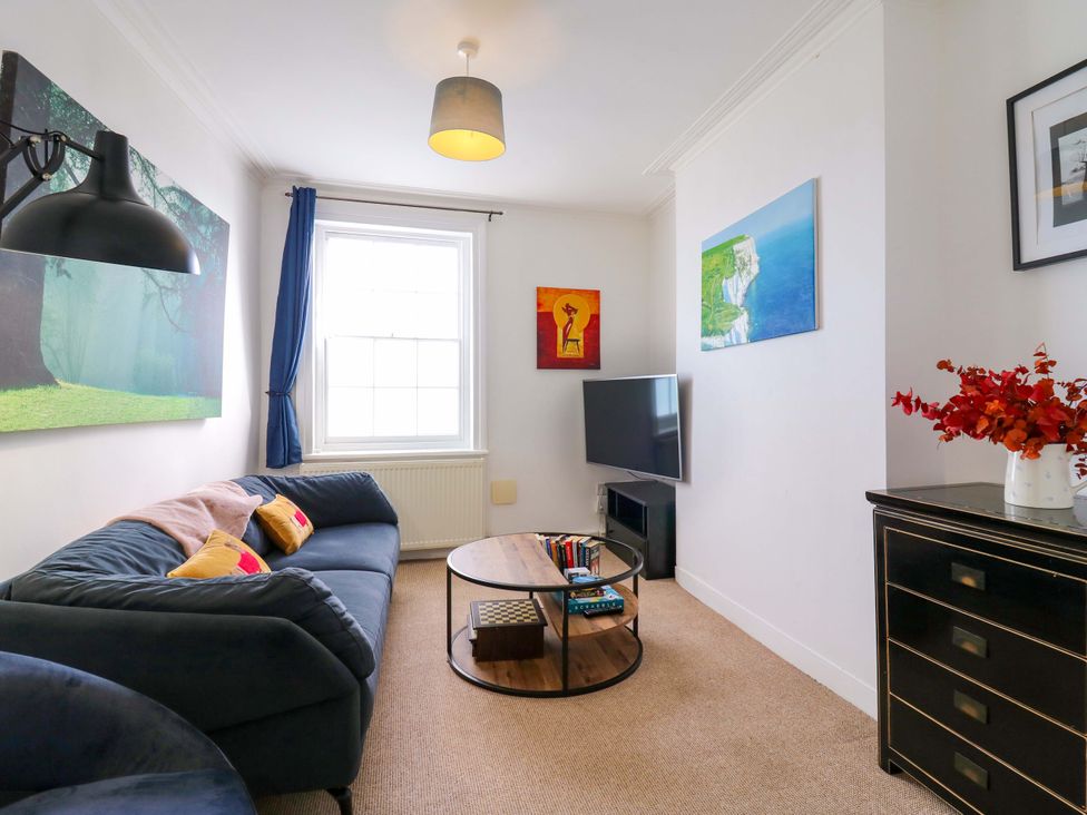 A living room with a sofa and coffee table at 7 Athol Terrace 