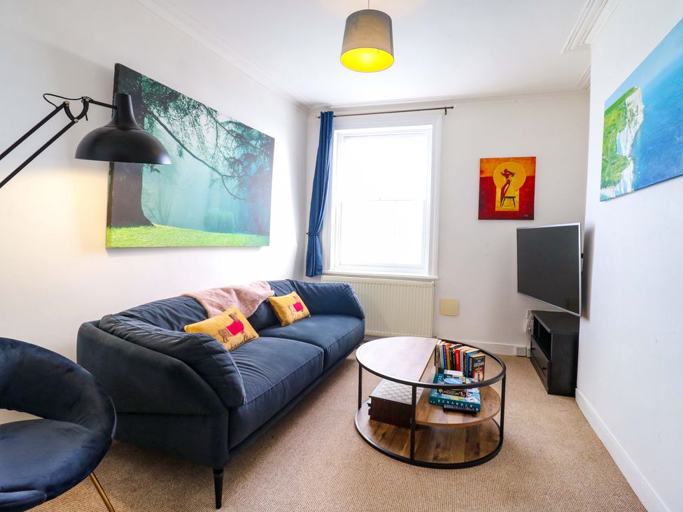 A living room with a sofa and coffee table at 7 Athol Terrace 