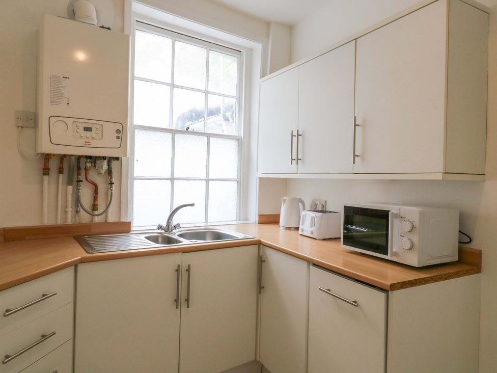 A kitchen with sink and appliances at 7 Athol Terrace