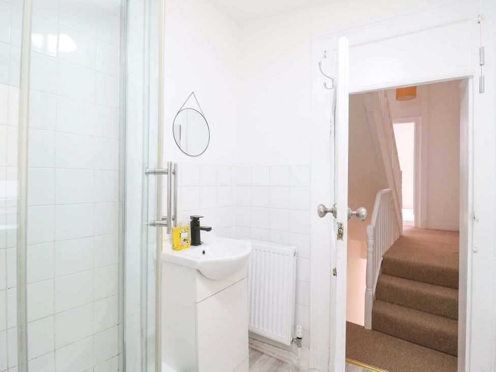A bathroom with a shower and sink at 7 Athol Terrace 