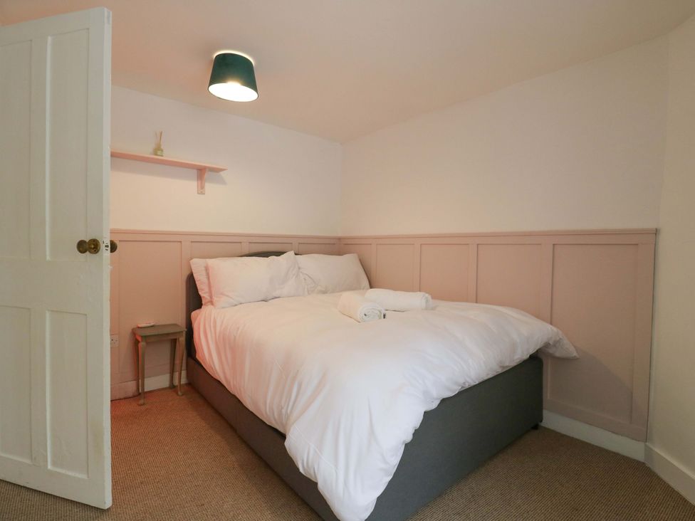A bedroom with a bed and nightstand at 7 Athol Terrace