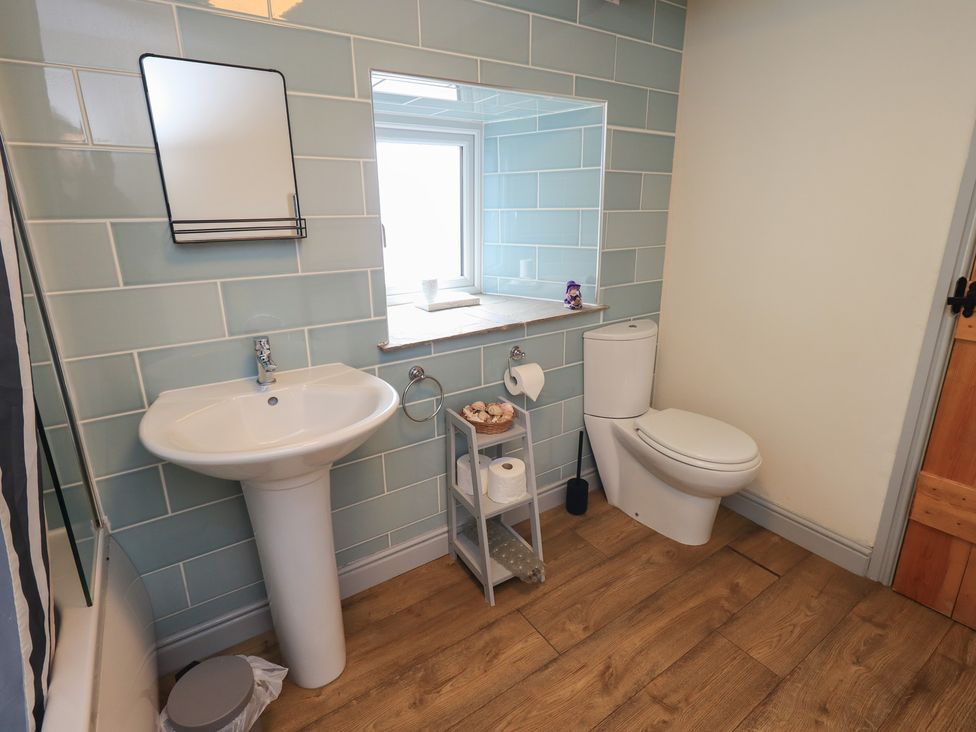 A bathroom with a sink and toilet at 4 Oak Cottages in Bentham, Yorkshire