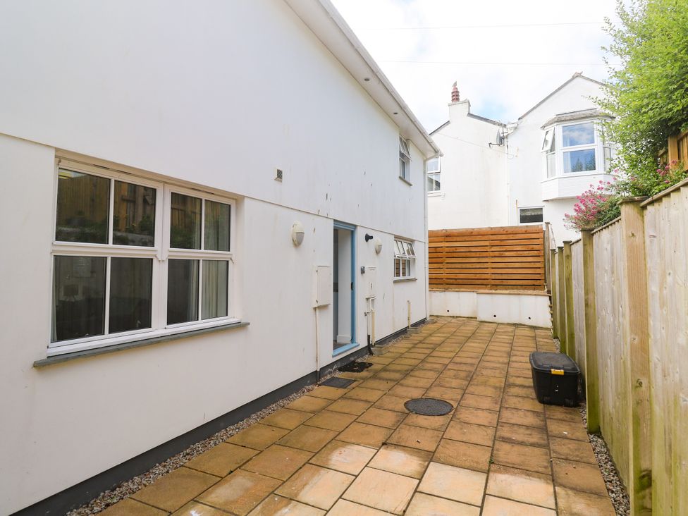 An outdoor area with patio and house exterior at Rosevale Villa St Ives