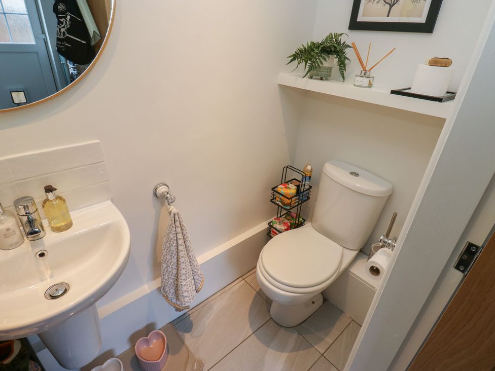 A bathroom with a sink and toilet at Olive Tree Cottage in York