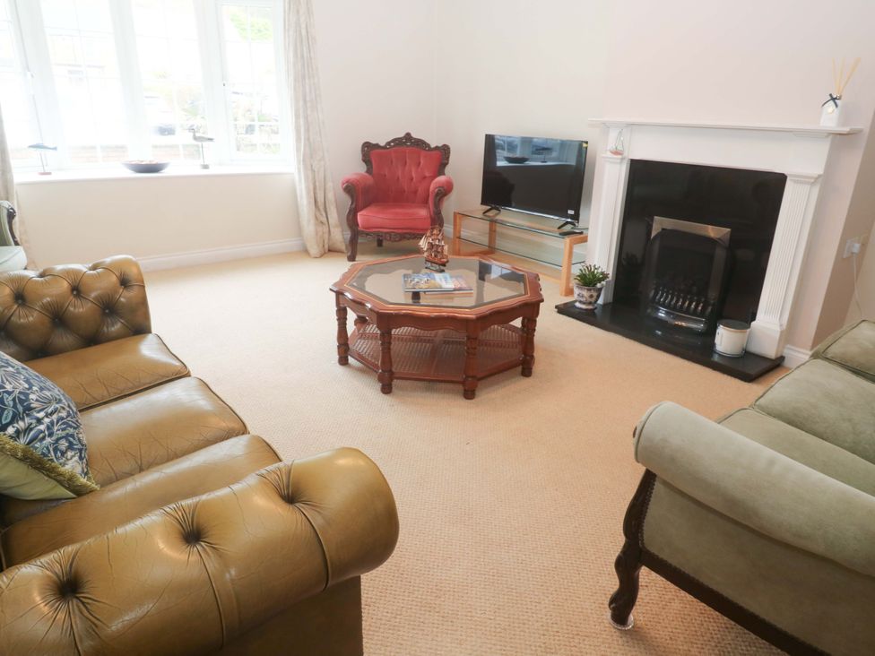 A living room with a coffee table and television at 16 Forth An Nance Redruth