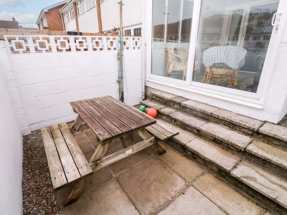 A garden with a picnic table and plastic balls at 16 Forth An Nance in Redruth
