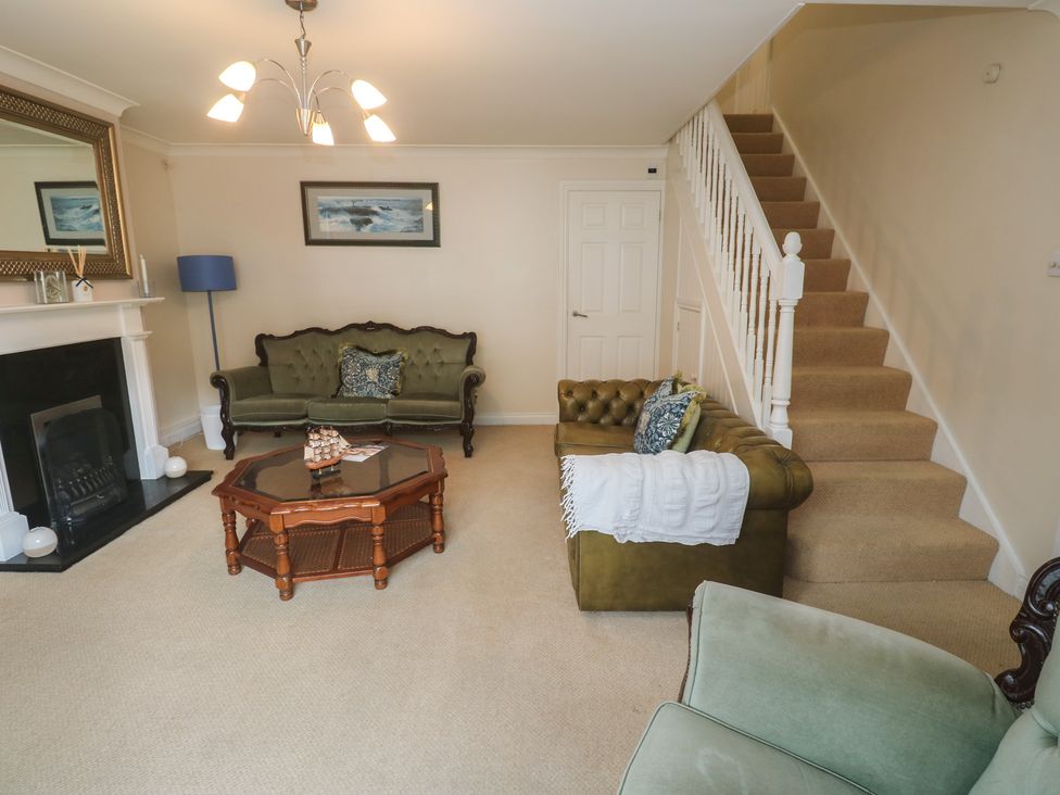 A living room with a sofa and coffee table at 16 Forth An Nance in Portreath