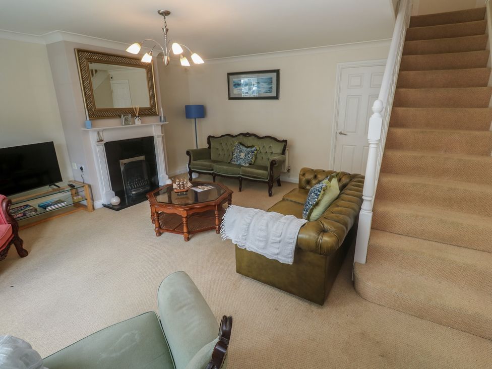 A living room with a sofa and television at 16 Forth An Nance, Portreath