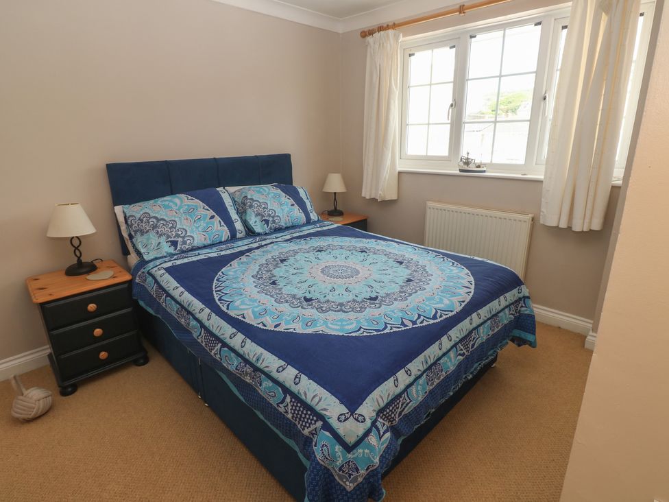 A bedroom with a bed and nightstand at 16 Forth An Nance Portreath