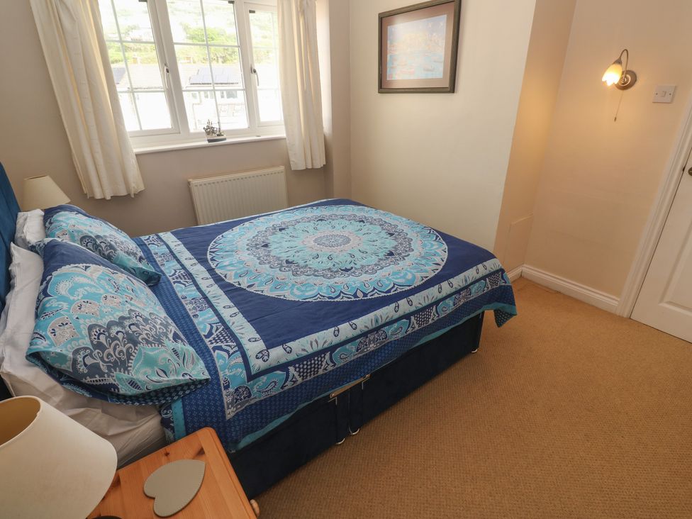 A bedroom with a bed and window at 16 Forth An Nance Portreath