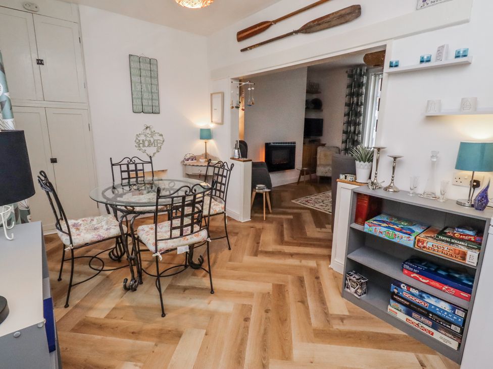 A dining room with a table and chairs at 55 Meldon terrace Newbiggin-by-the-Sea