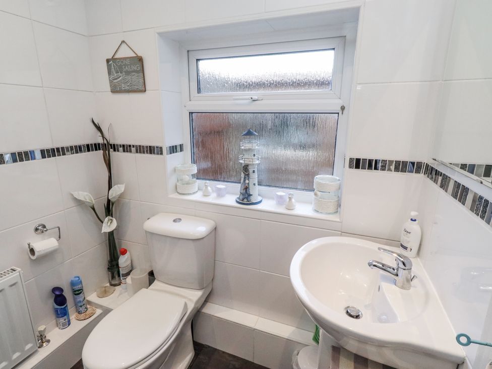 A bathroom with a toilet and sink at 55 Meldon terrace in Newbiggin-by-the-Sea