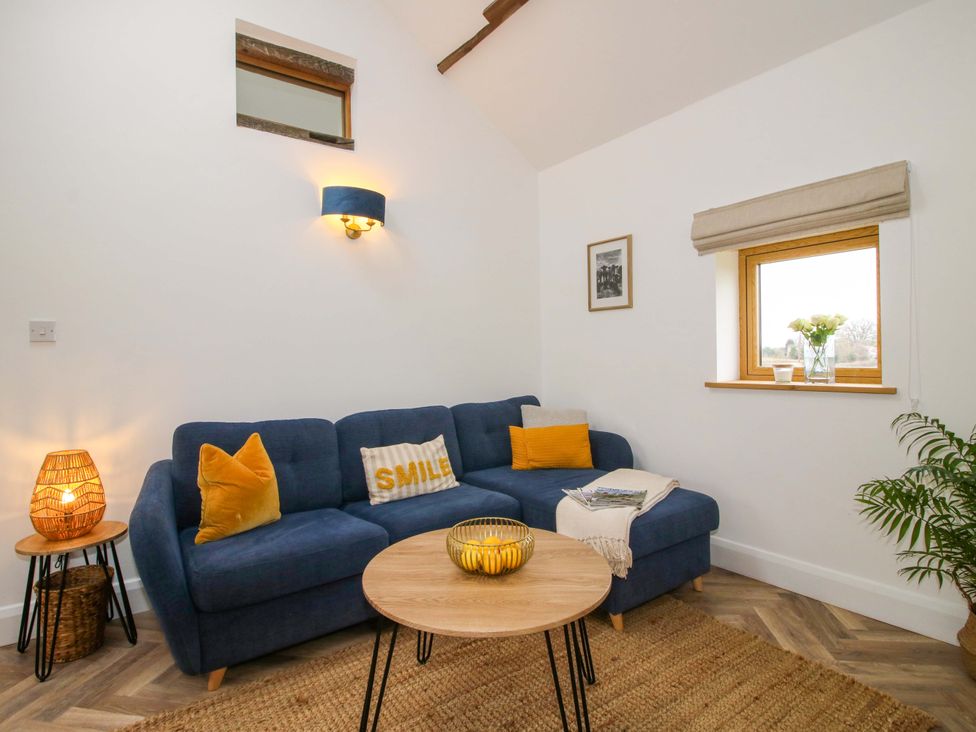 A living room with a sofa and coffee table at The Blacksmiths Shop