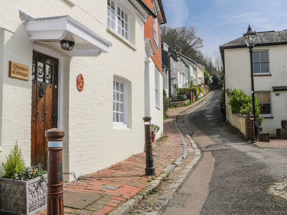 An exterior view of Quince Cottage on a street in Lewes