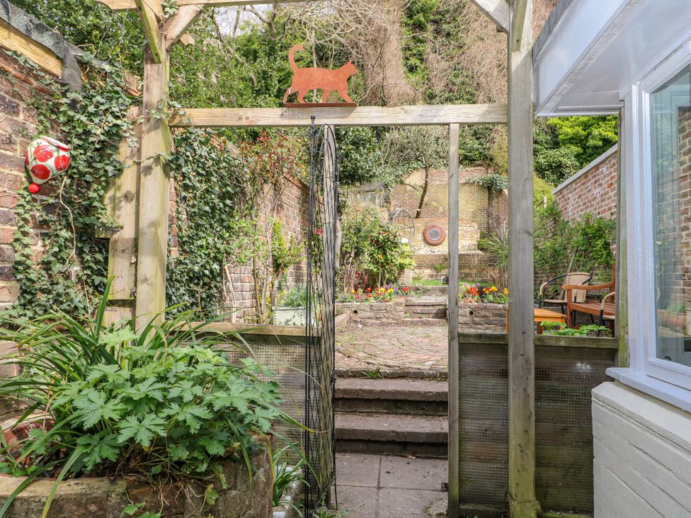 A garden with steps and plants at 7 Chapel Hill Quinc Cottage Lewes