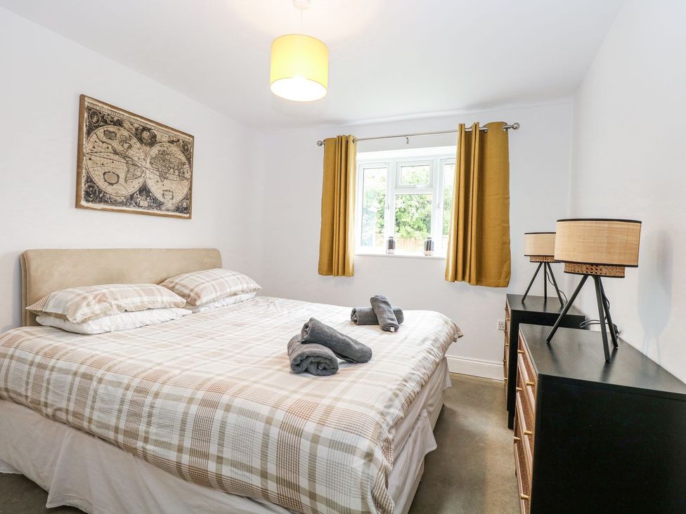 A bedroom with a bed and window at The Ivy in Norwich