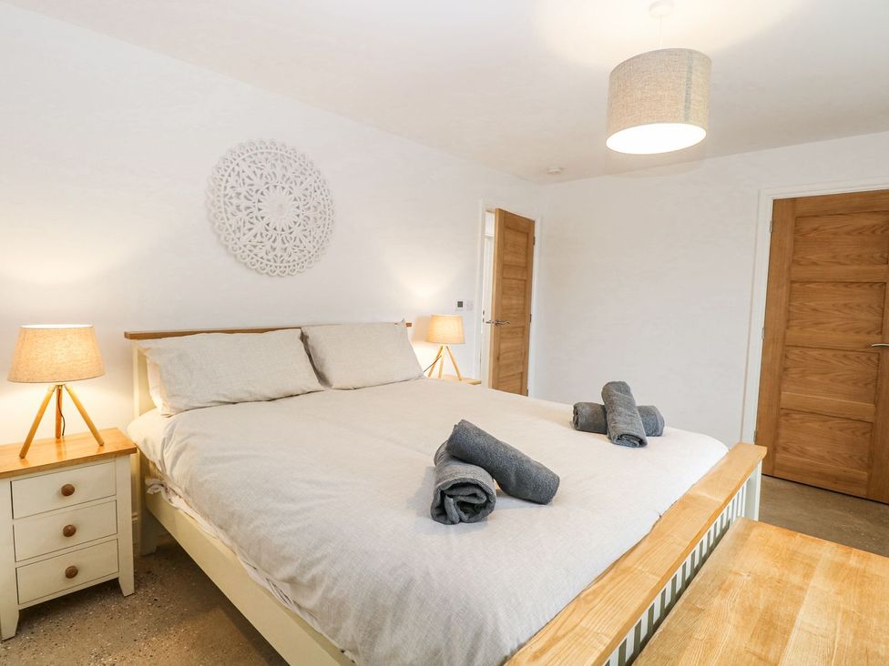 A bedroom with a bed and bedside tables at The Ivy in Norwich