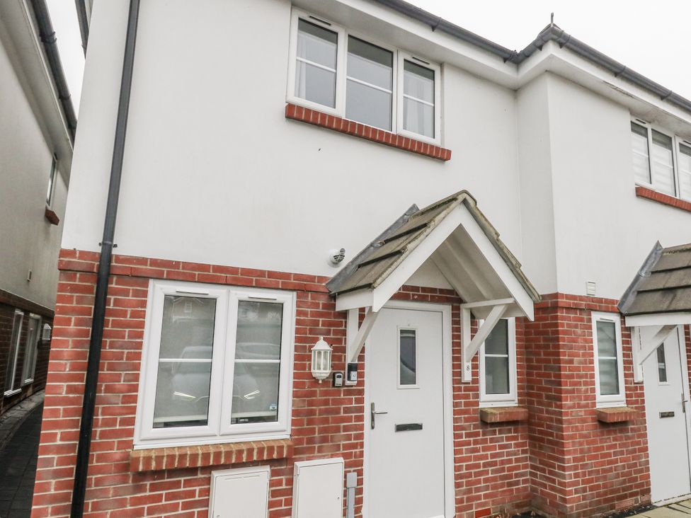 A house facade with windows and doors at 8 Park View Grove Weymouth