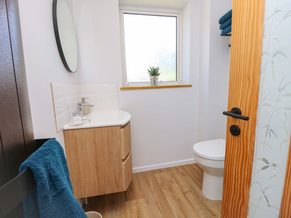 A bathroom with a sink and toilet at Camellia Cottage Wimborne Minster