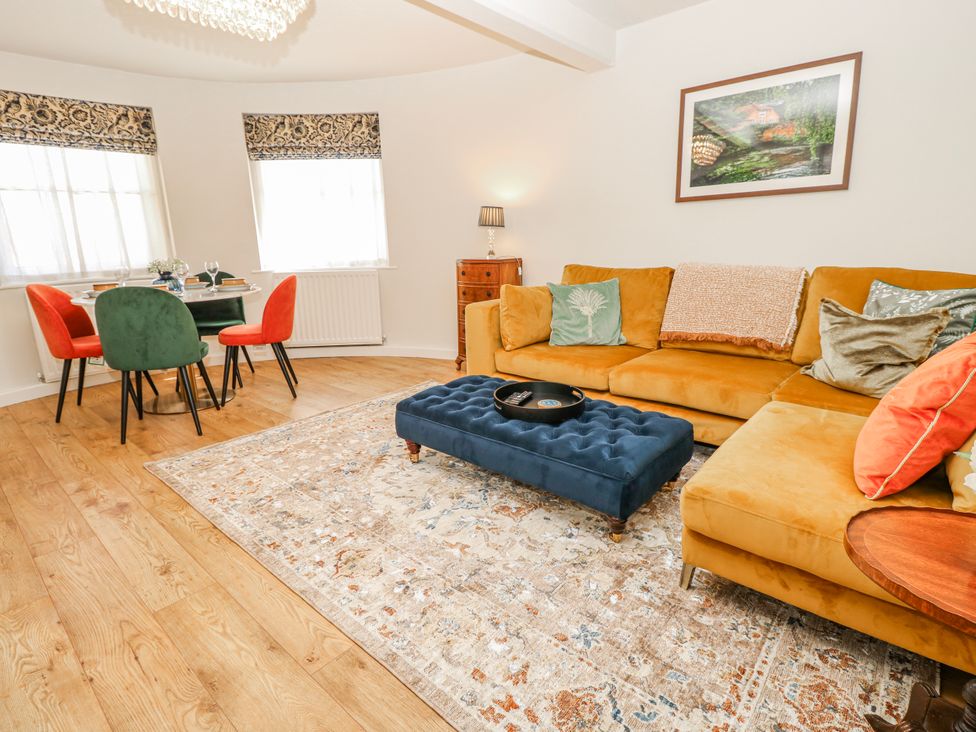 A living room with a sofa and coffee table at 1A Clifton Road Winchester