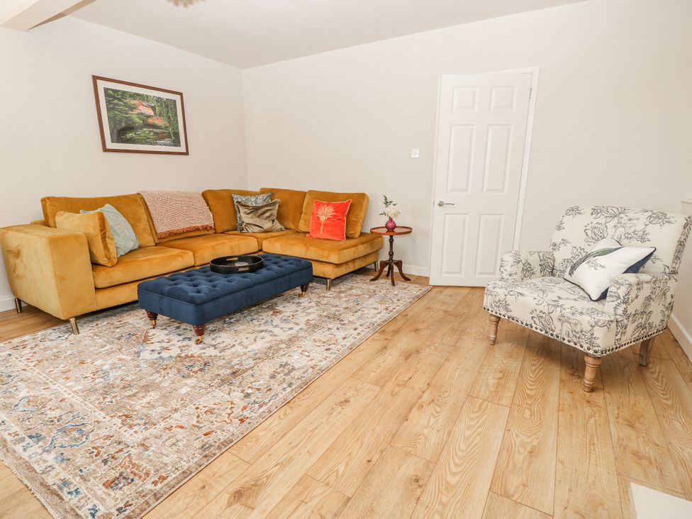 A living room with a sofa and coffee table at 1A Clifton Road in Winchester