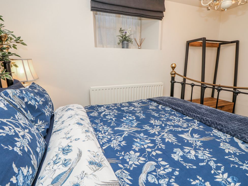A bedroom with a bed and a window at 1A Clifton Road in Winchester