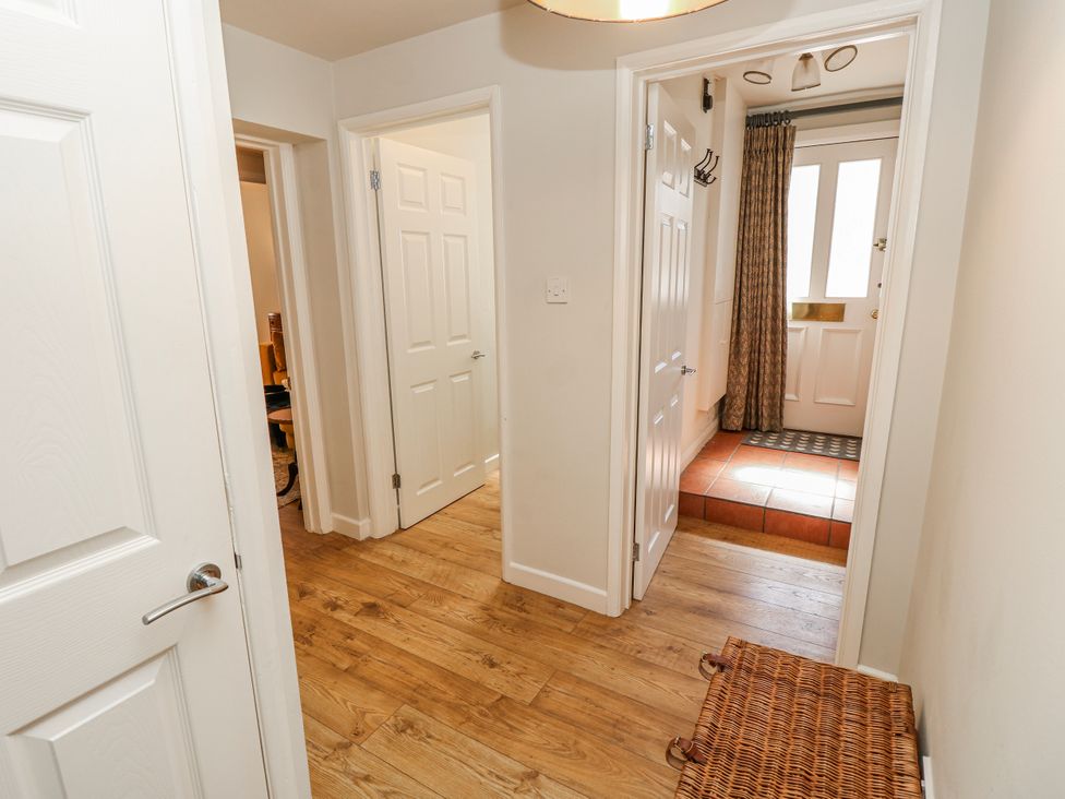 A hallway with doors leading to rooms at 1A Clifton Road in Winchester