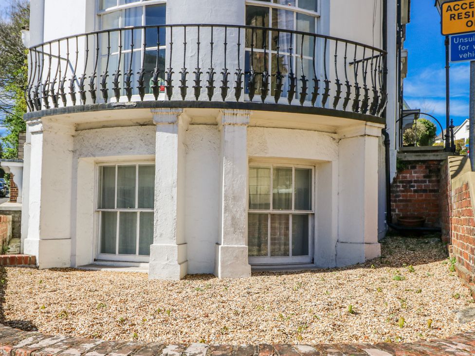 A building exterior with a balcony and windows at 1A Clifton Road in Winchester