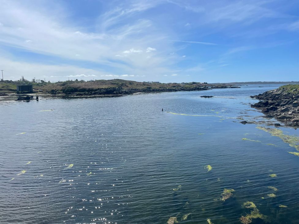 A coastal view with water and rocks at Red House in Carraroe, County Galway