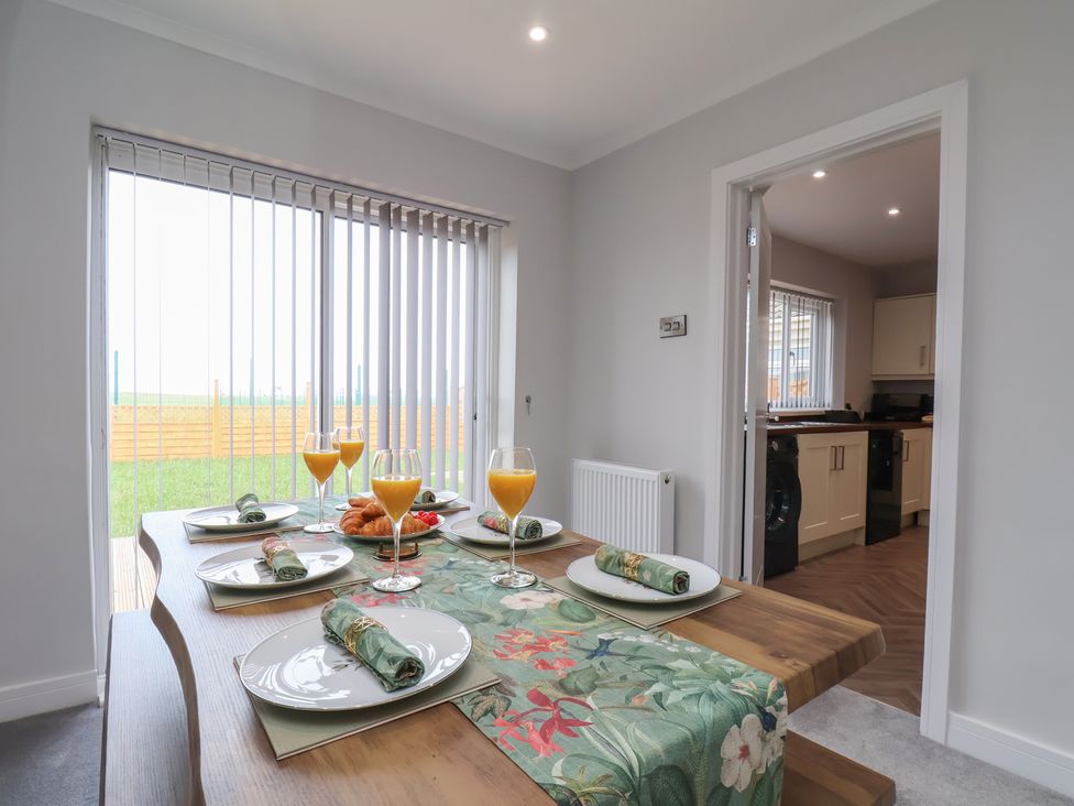 A dining room with a table set for breakfast at Sea View House in Marske-By-The-Sea