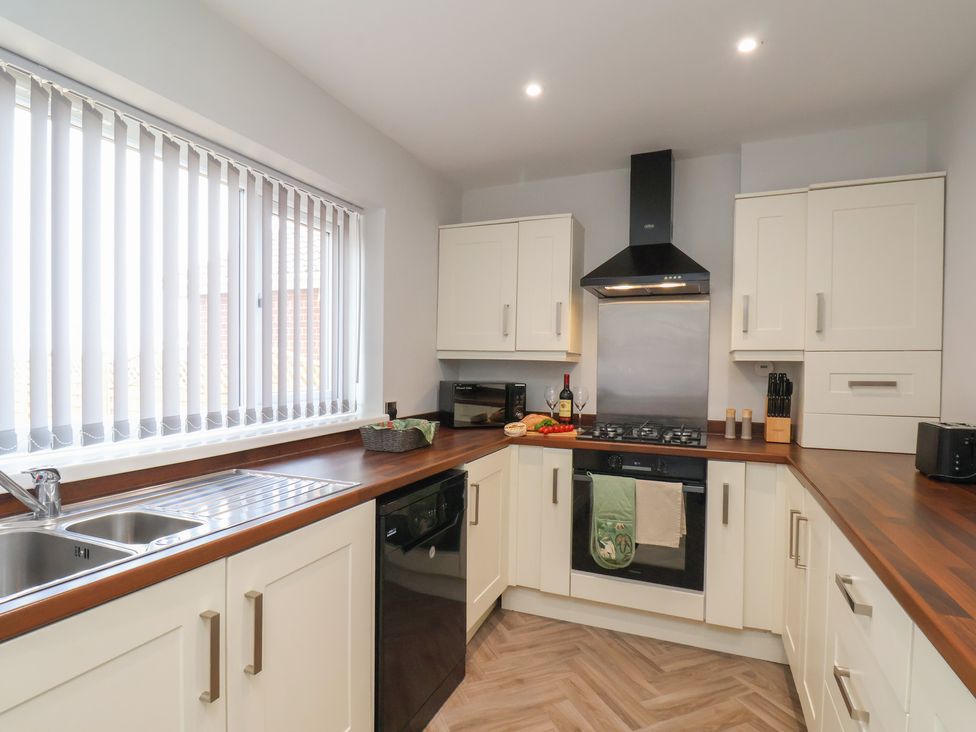 A kitchen with appliances and countertop at Sea View House in Marske-By-The-Sea