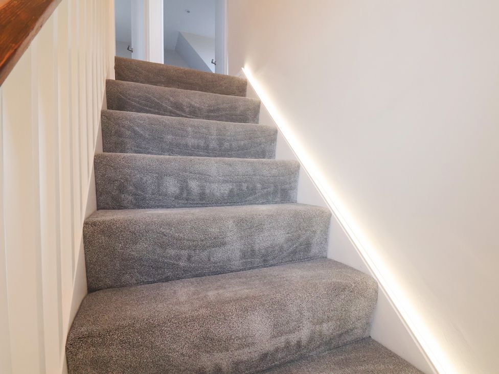 A carpeted staircase at Sea View House in Marske-By-The-Sea