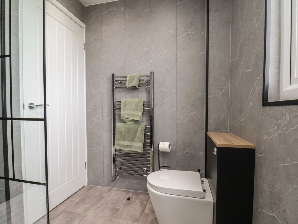 A bathroom with a towel rack and toilet at Sea View House in Marske-By-The-Sea