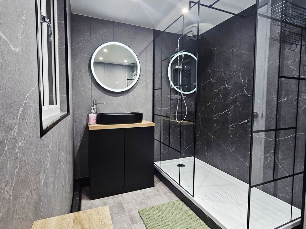 A bathroom with a sink and shower at Sea View House in Marske-By-The-Sea