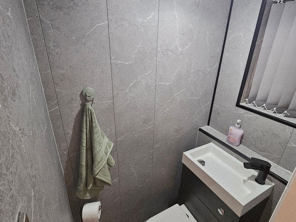 A bathroom with a sink and towel at Sea View House in Marske-By-The-Sea
