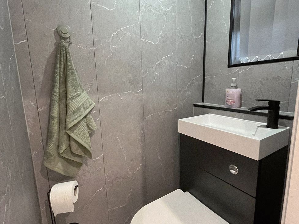 A bathroom with a sink and toilet at Sea View House in Marske-By-The-Sea