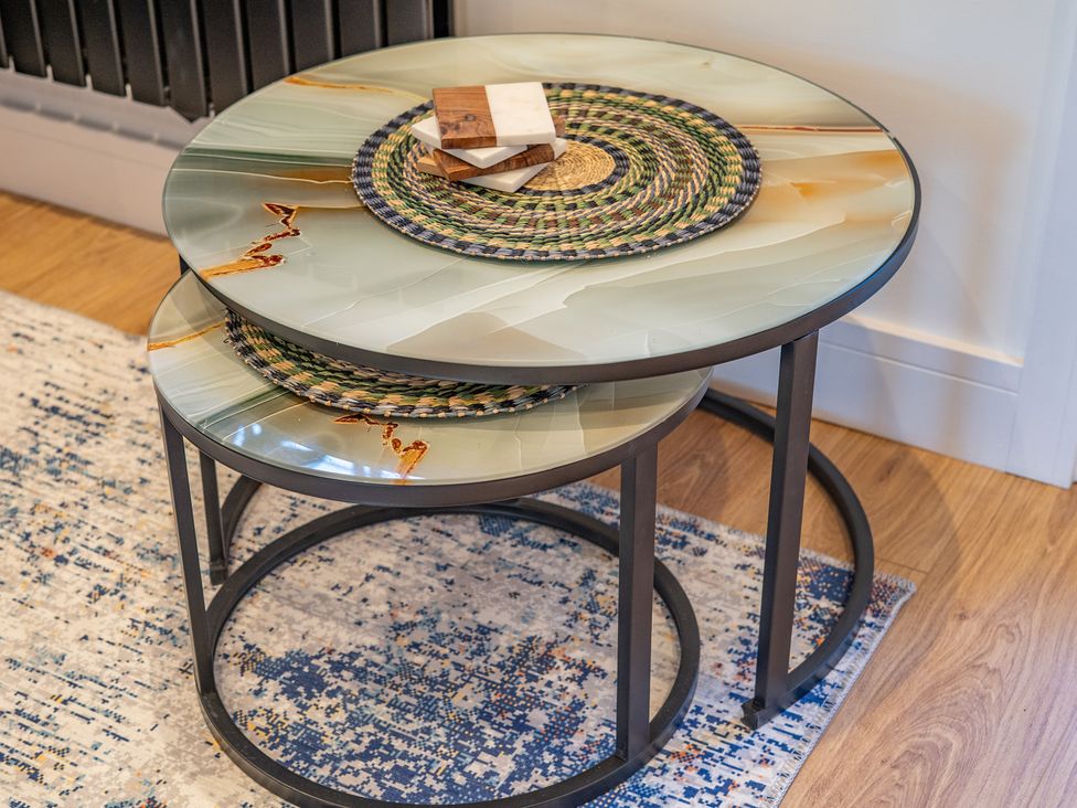 A coffee table with a coaster on top in a living room at 4 Bryn Heulog in Wrexham
