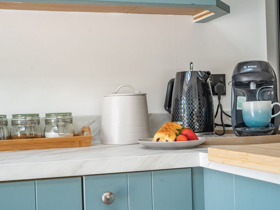 A kitchen with a kettle and coffee machine at 4 Bryn Heulog in Wrexham