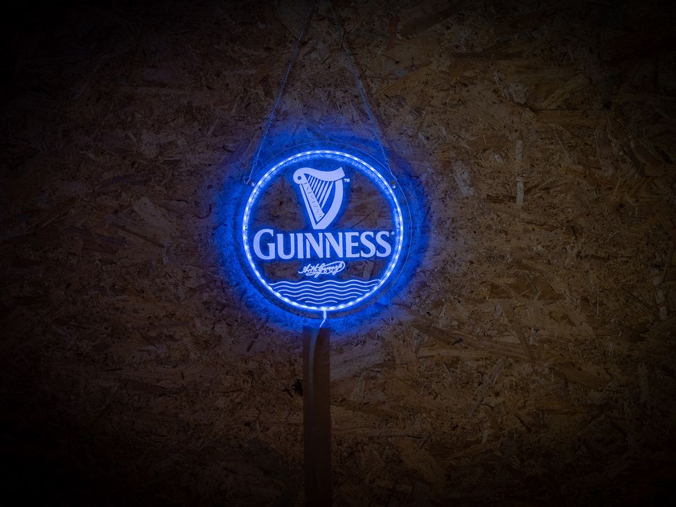 A neon sign of Guinness at 4 Bryn Heulog in Wrexham