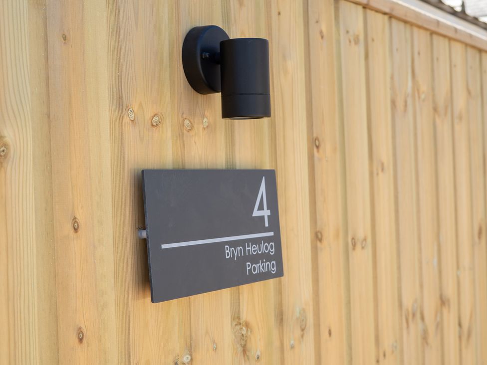 A sign indicating parking for 4 Bryn Heulog outside