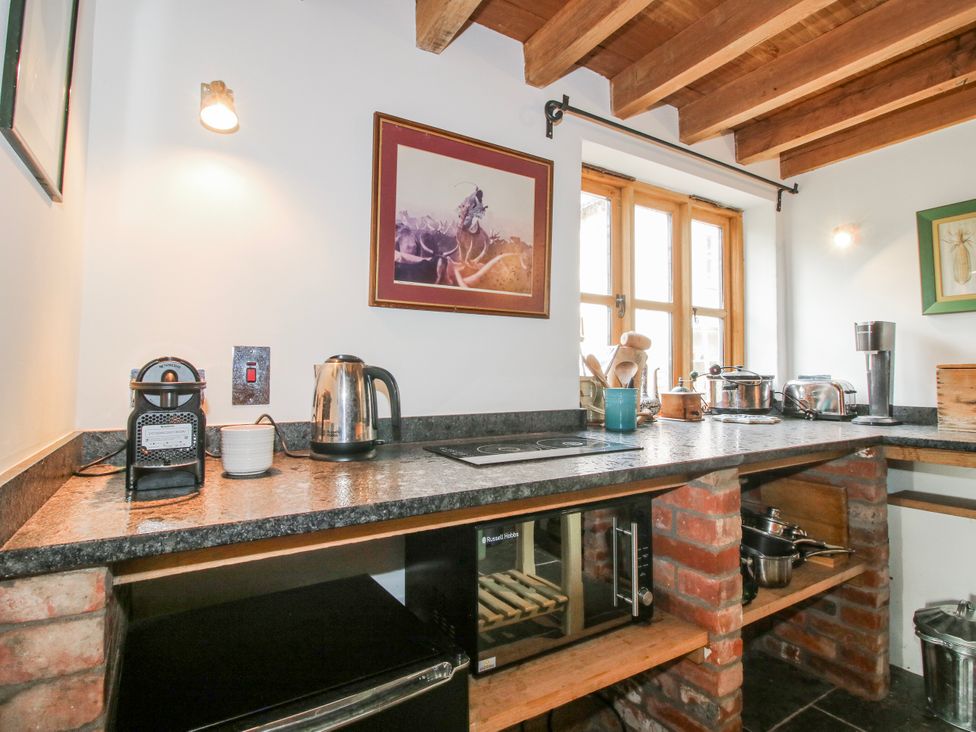 A kitchen with coffee maker and kettle at Bell House Cottage near Wistanstow near Craven Arms